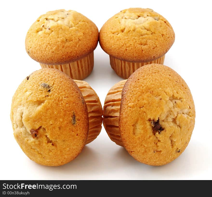 Muffins with chocolate filling isolated on white background