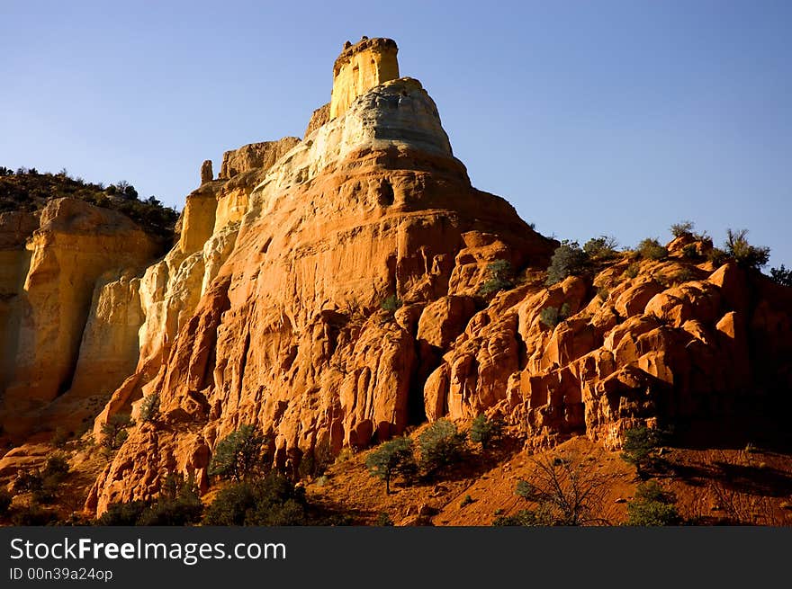 Sunset over desert rock formation