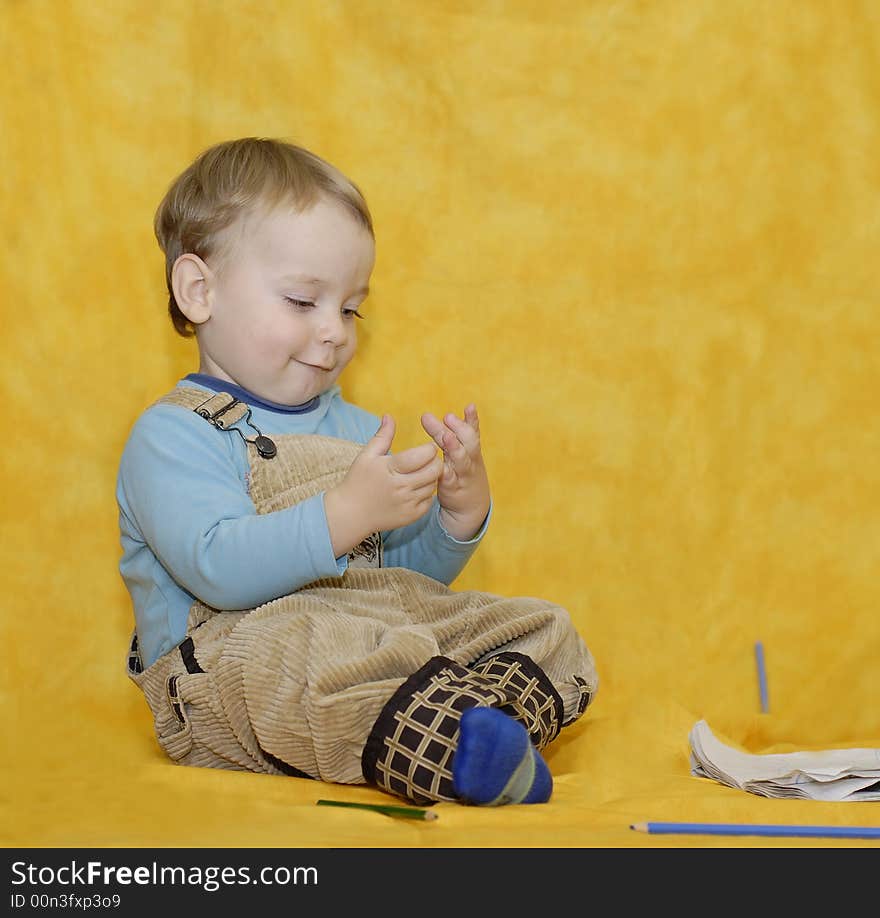 Little boy is playing with hands