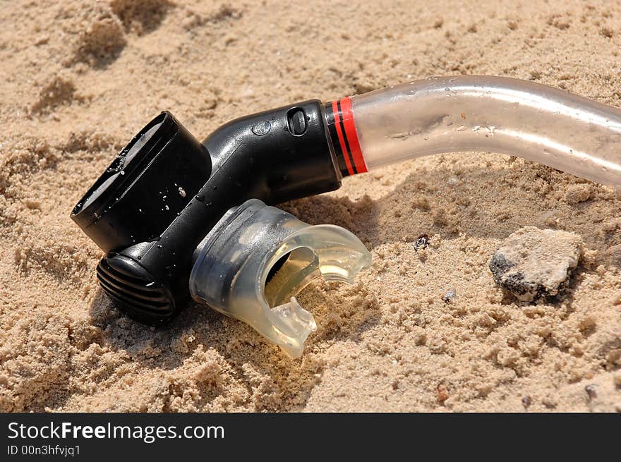 Plastic snorkel on beach