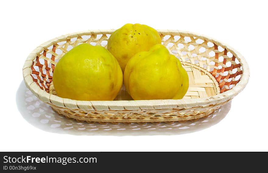 Three quinces in a basket