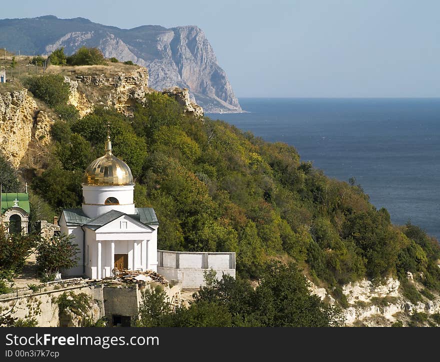 Little orthodox church on a rock at the sea. Little orthodox church on a rock at the sea