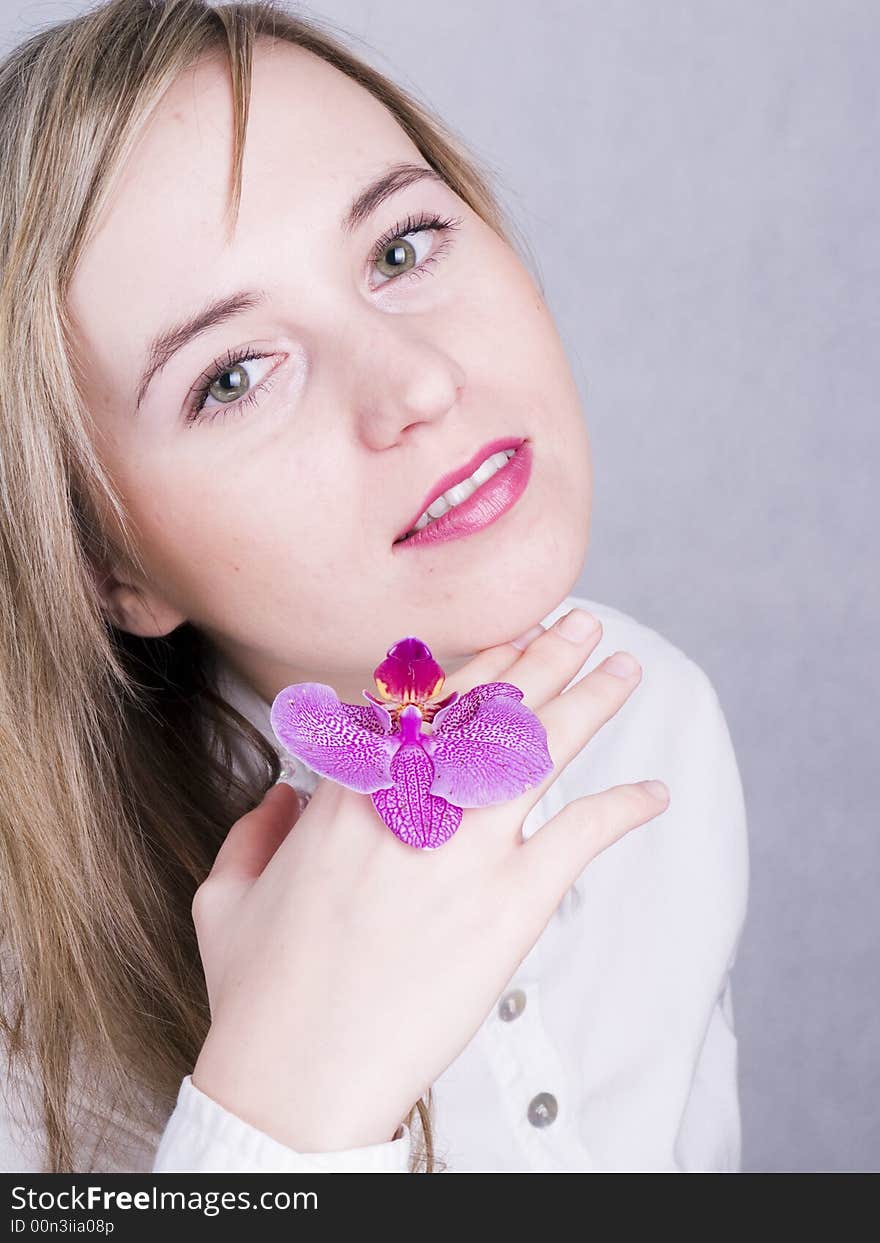 Smiling young woman with flower. Smiling young woman with flower