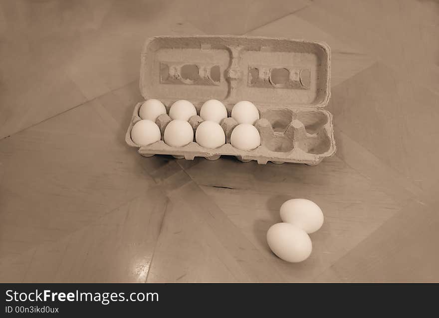 A picture of a container of eggs on table