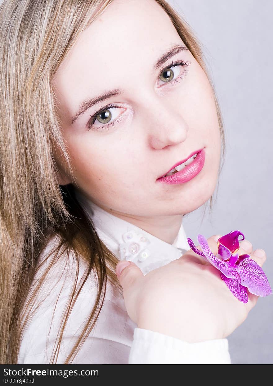 Smiling young woman with flower. Smiling young woman with flower