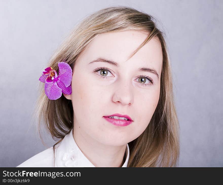 Smiling young woman with flower. Smiling young woman with flower