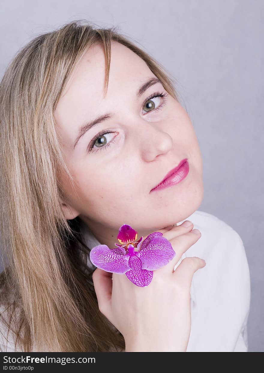 Smiling young woman with flower. Smiling young woman with flower