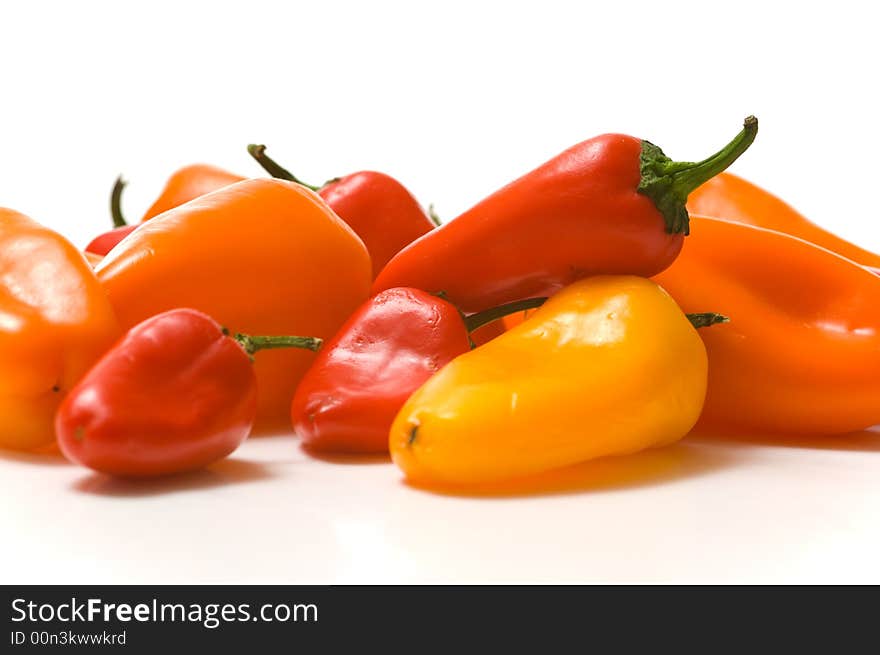 Fresh sweet peppers on white background, with copy space