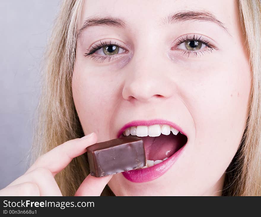 Girl eating chocolate