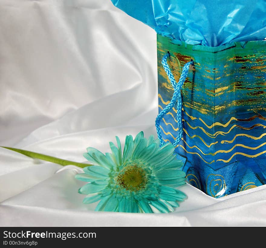 Pretty gift bag on white satin with chrysanthemum. Pretty gift bag on white satin with chrysanthemum.