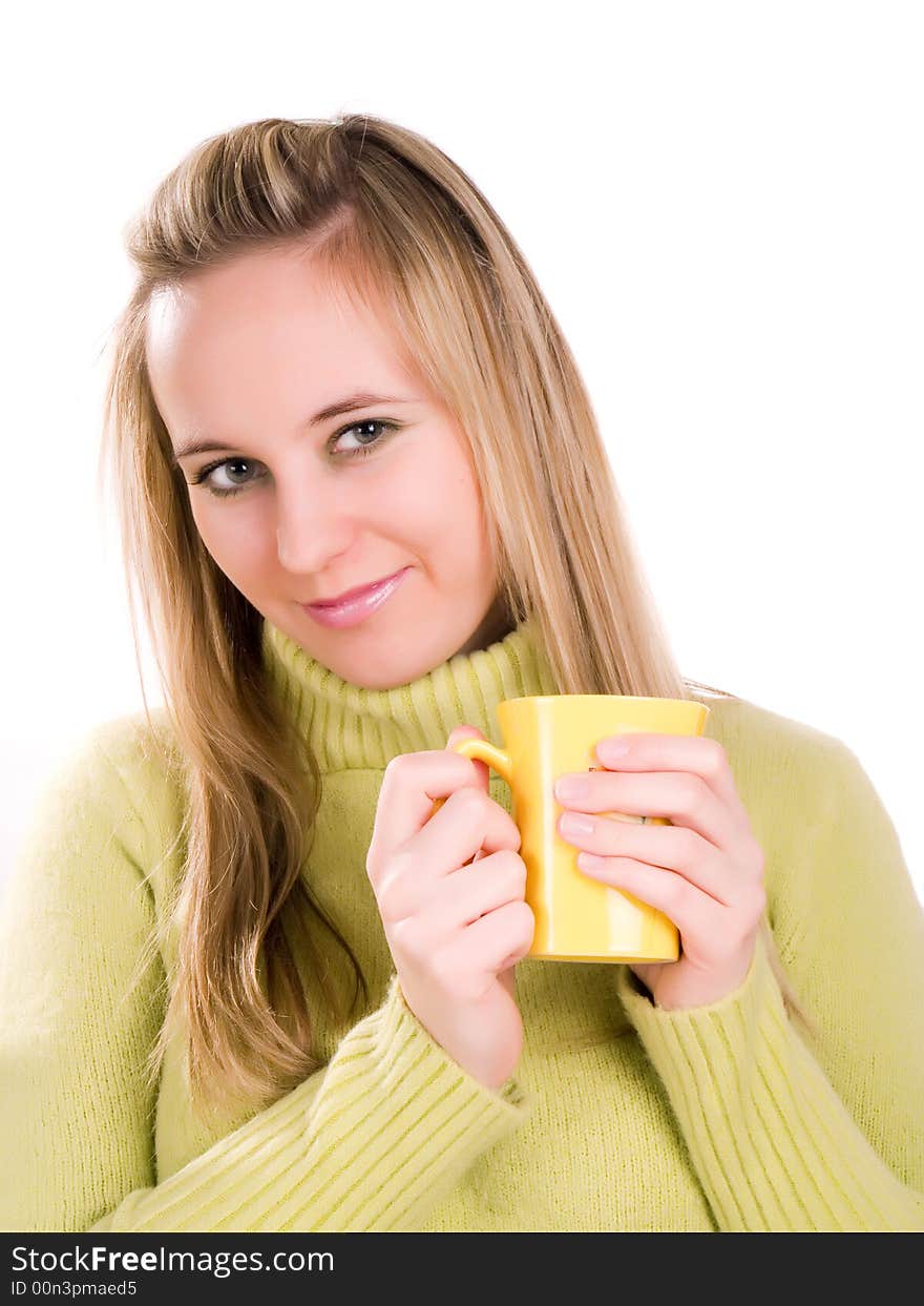 Young woman sitting down with a cup of tea