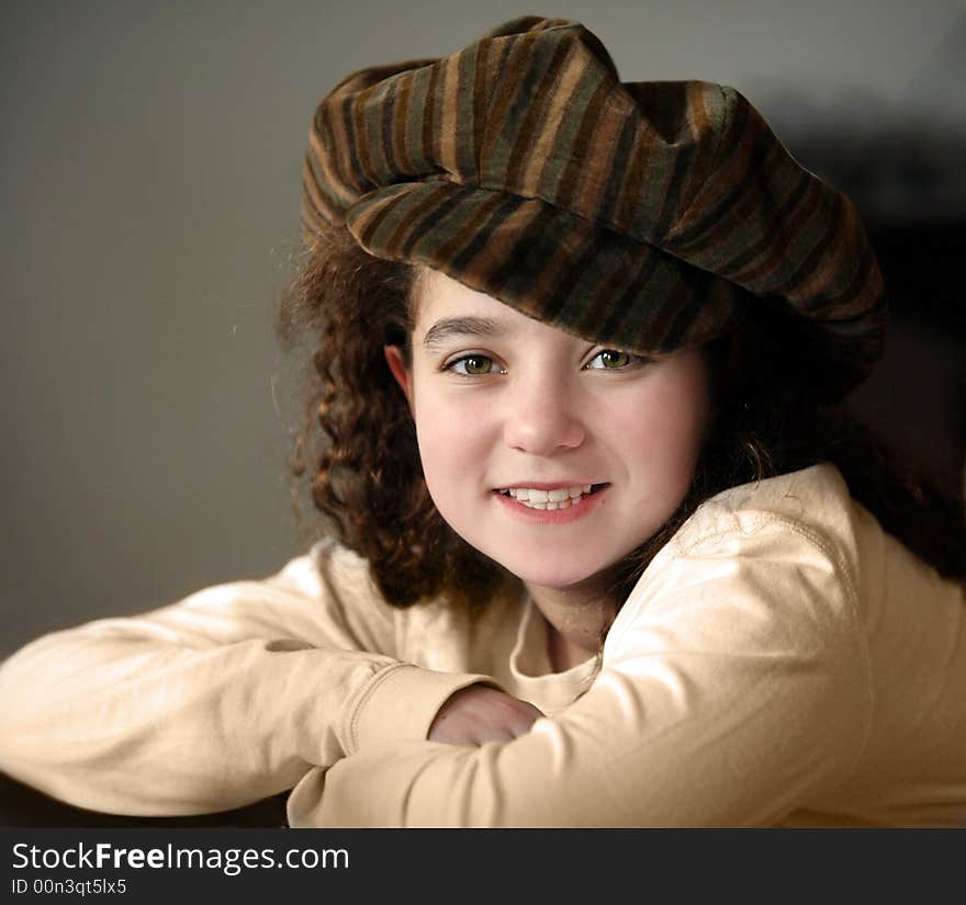 Smiling 10 year old girl in a hat. Smiling 10 year old girl in a hat