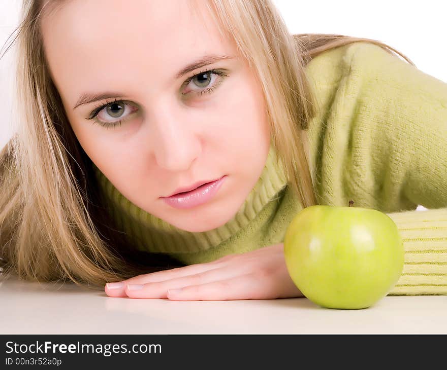 Young woman and green apple