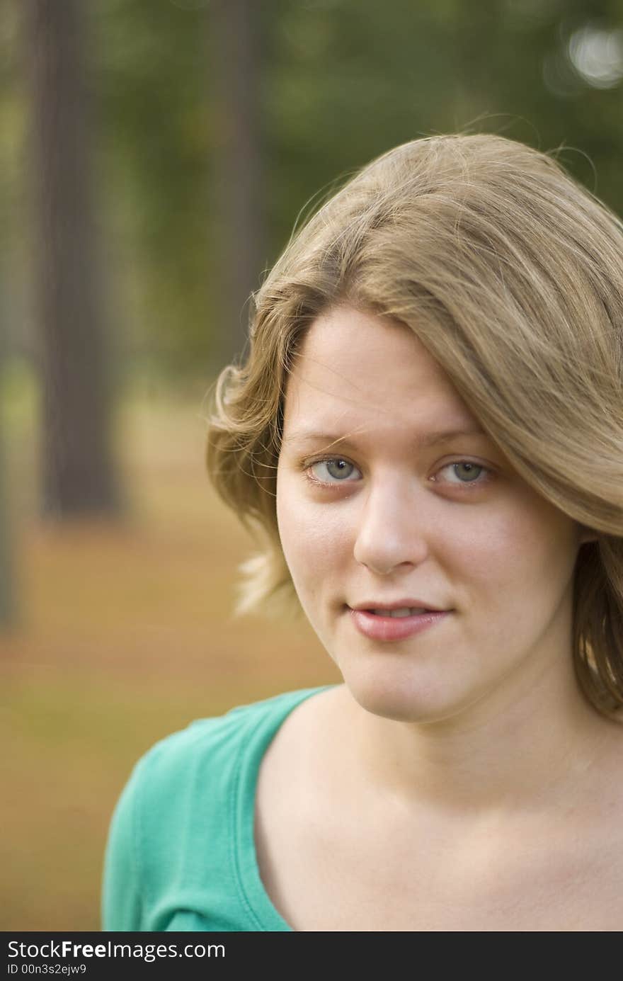 Portrait of a girl with the wind blowing through her hair. Focus is only centered around the eyes. Portrait of a girl with the wind blowing through her hair. Focus is only centered around the eyes