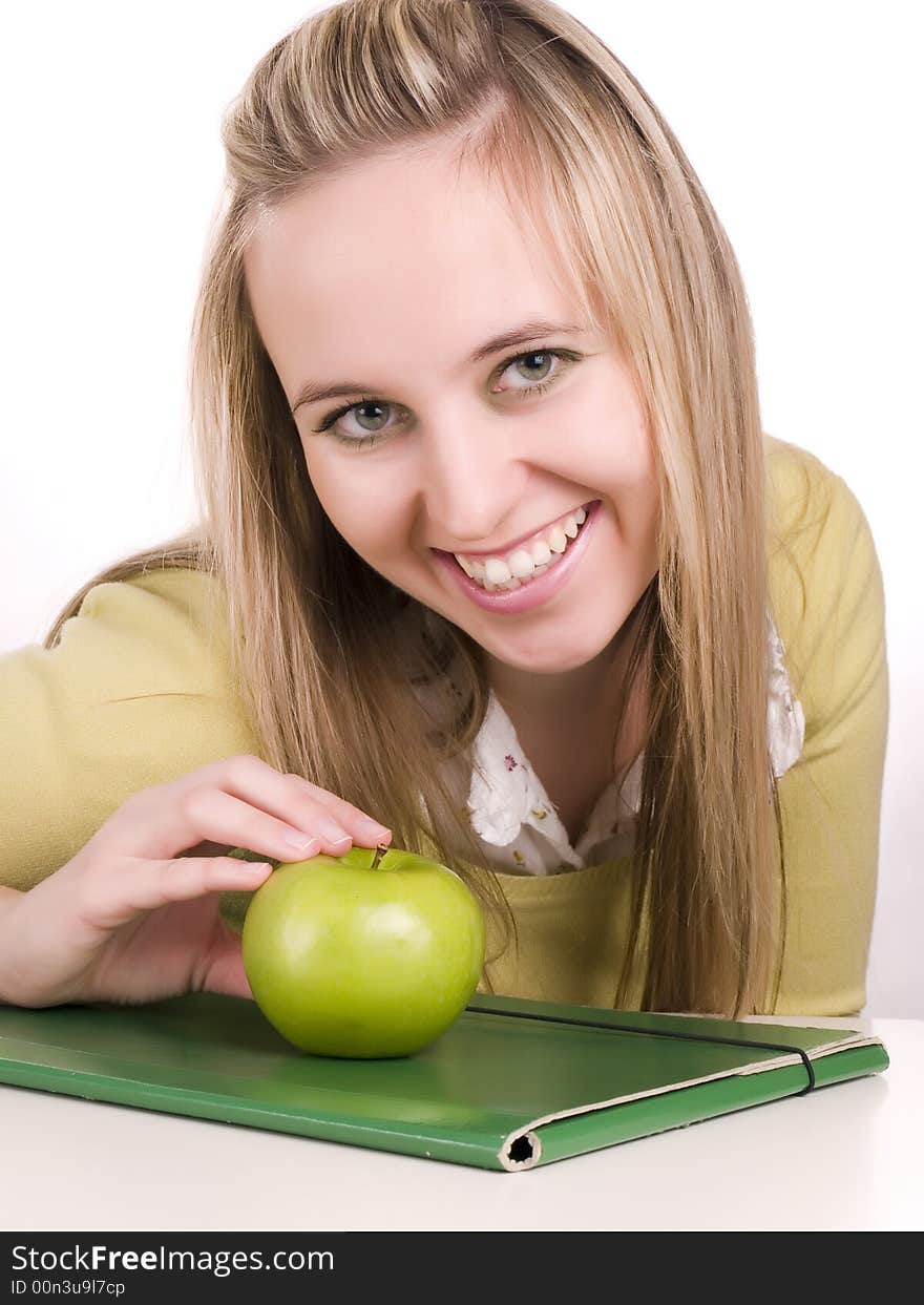 Female student with green folder and apple