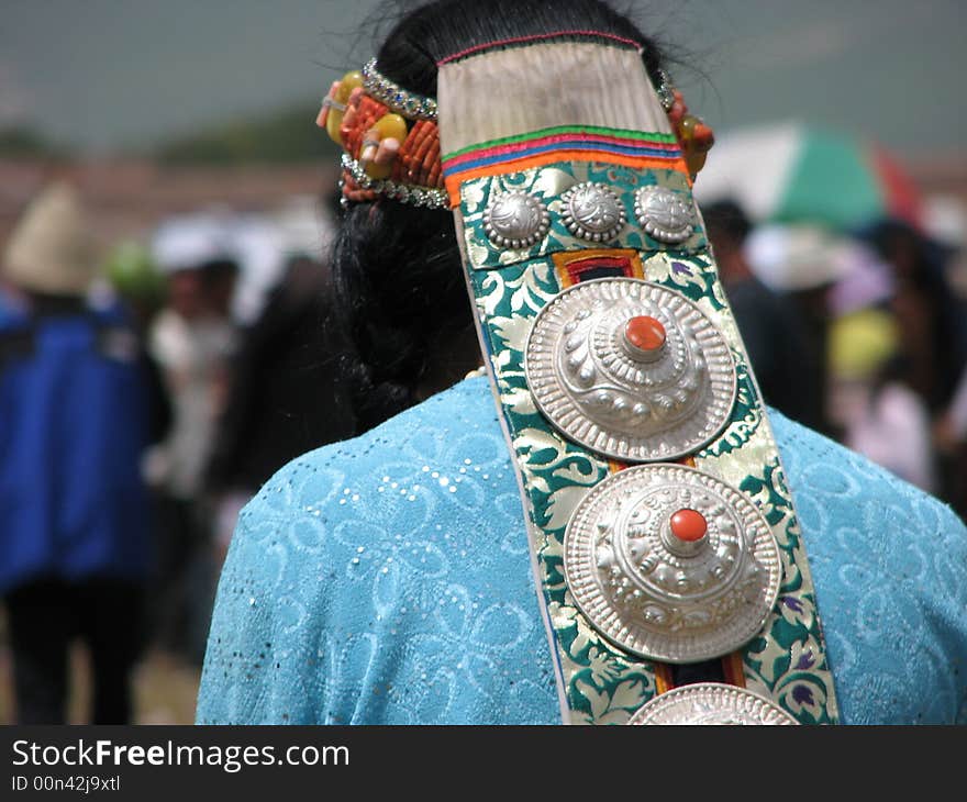 White silver made head wear(accessories) worn by a tibetan woman. White silver made head wear(accessories) worn by a tibetan woman