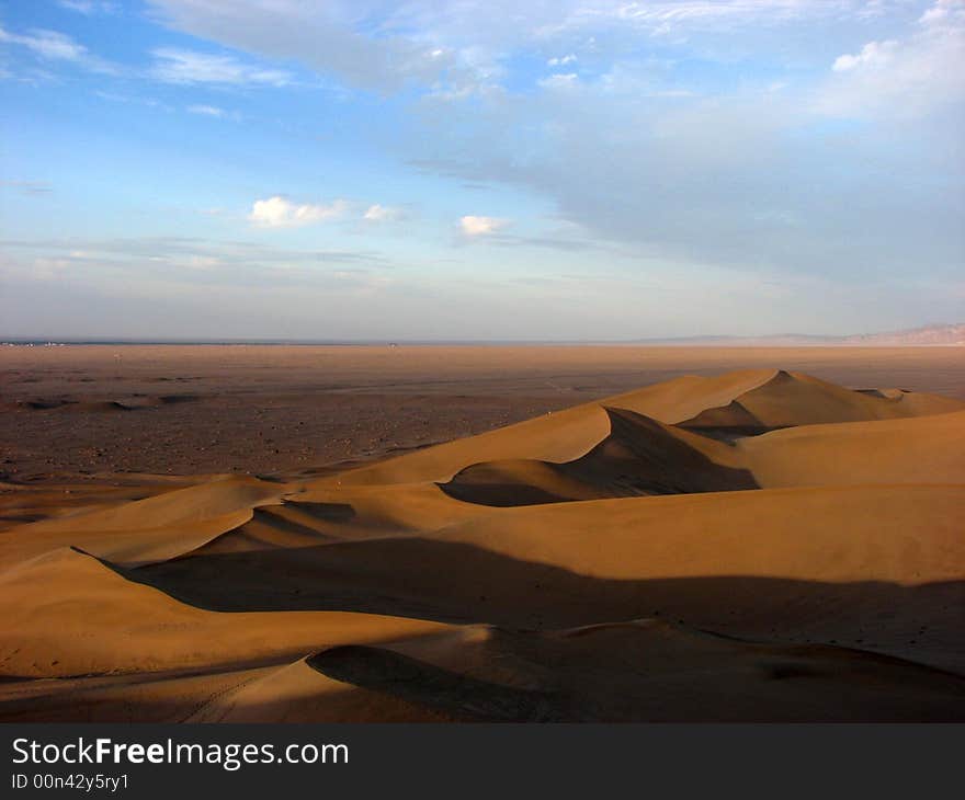 Wide desert has light side and shadow. Wide desert has light side and shadow