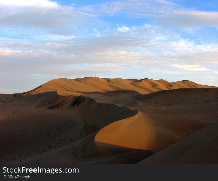 Wide desert has light side and shadow. Wide desert has light side and shadow