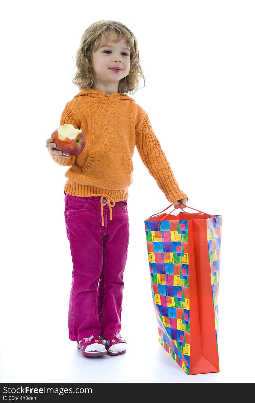 Beautiful little girl with aple on isolated background