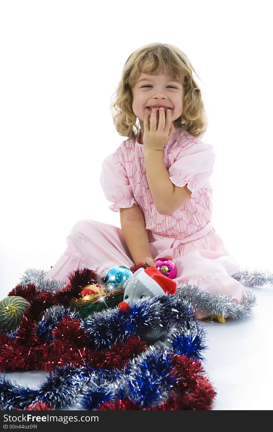 Beautiful little girl with christmas decoration on isolated background