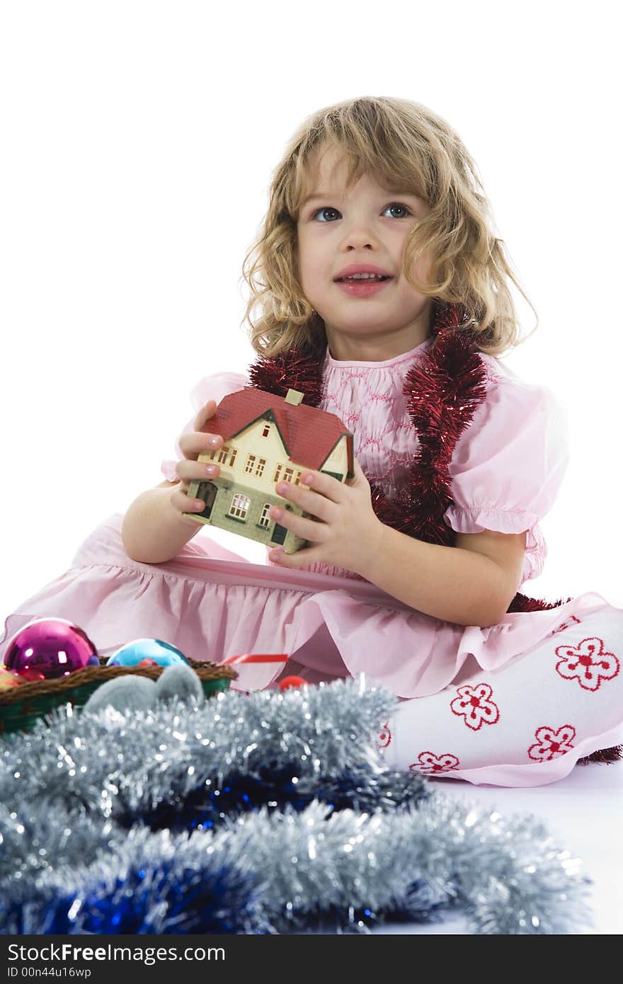 Beautiful little girl with christmas decoration on isolated background