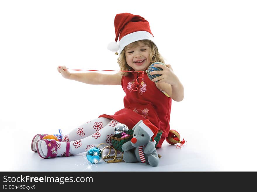 Beautiful little girl with christmas decoration on isolated background