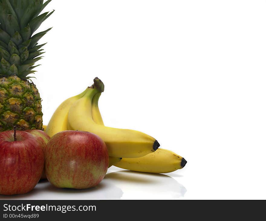 Selection of fresh fruits on a white surface. Selection of fresh fruits on a white surface.