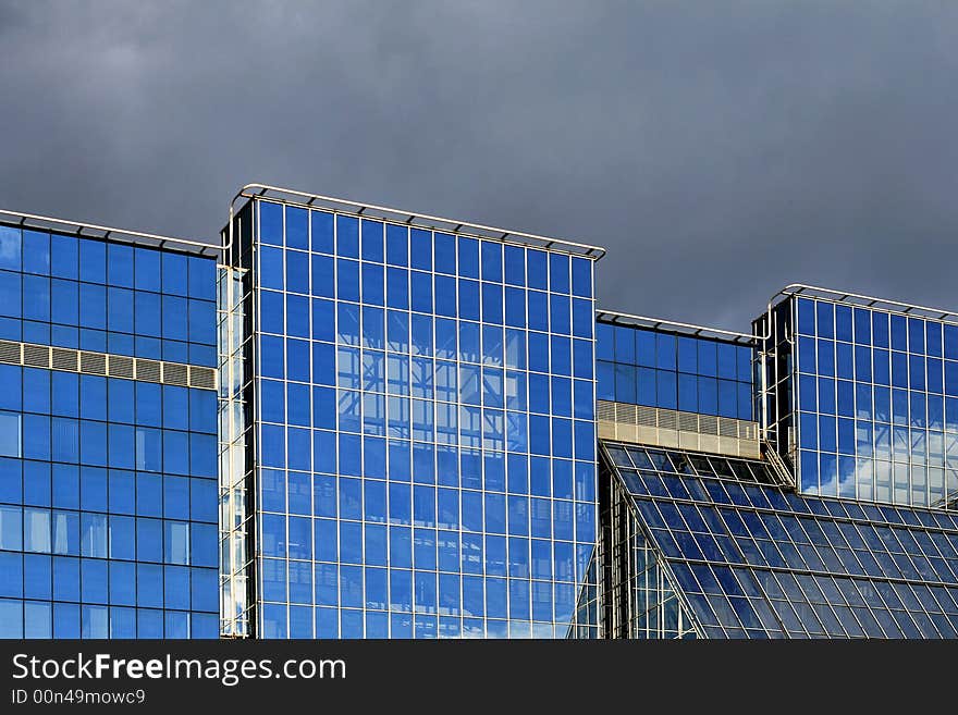 Business building with blue glass and reflections. Business building with blue glass and reflections