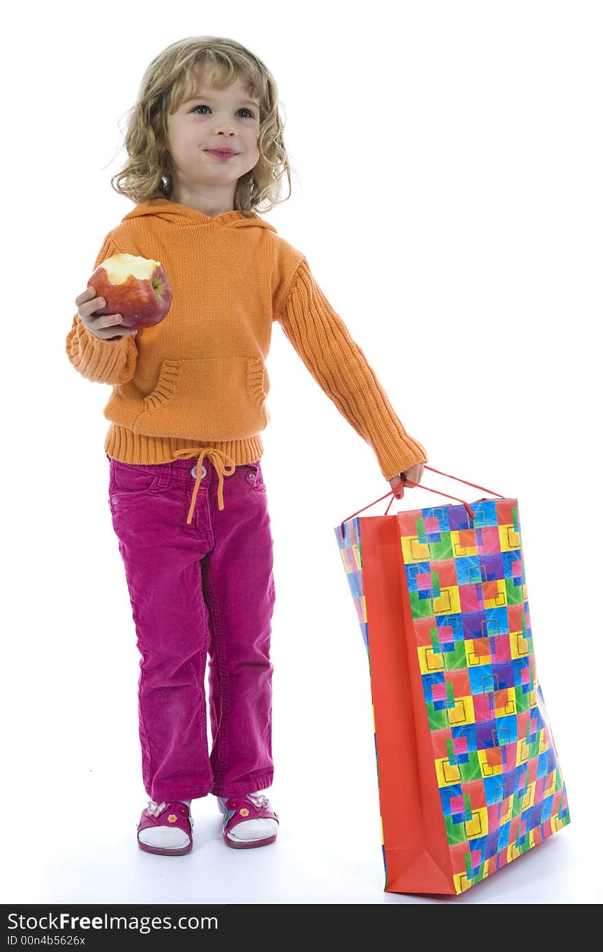 Beautiful little girl with aple on isolated background