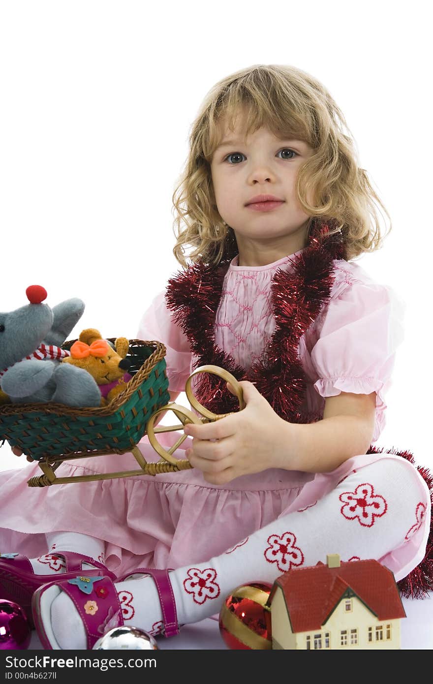 Beautiful little girl with christmas decoration on isolated background