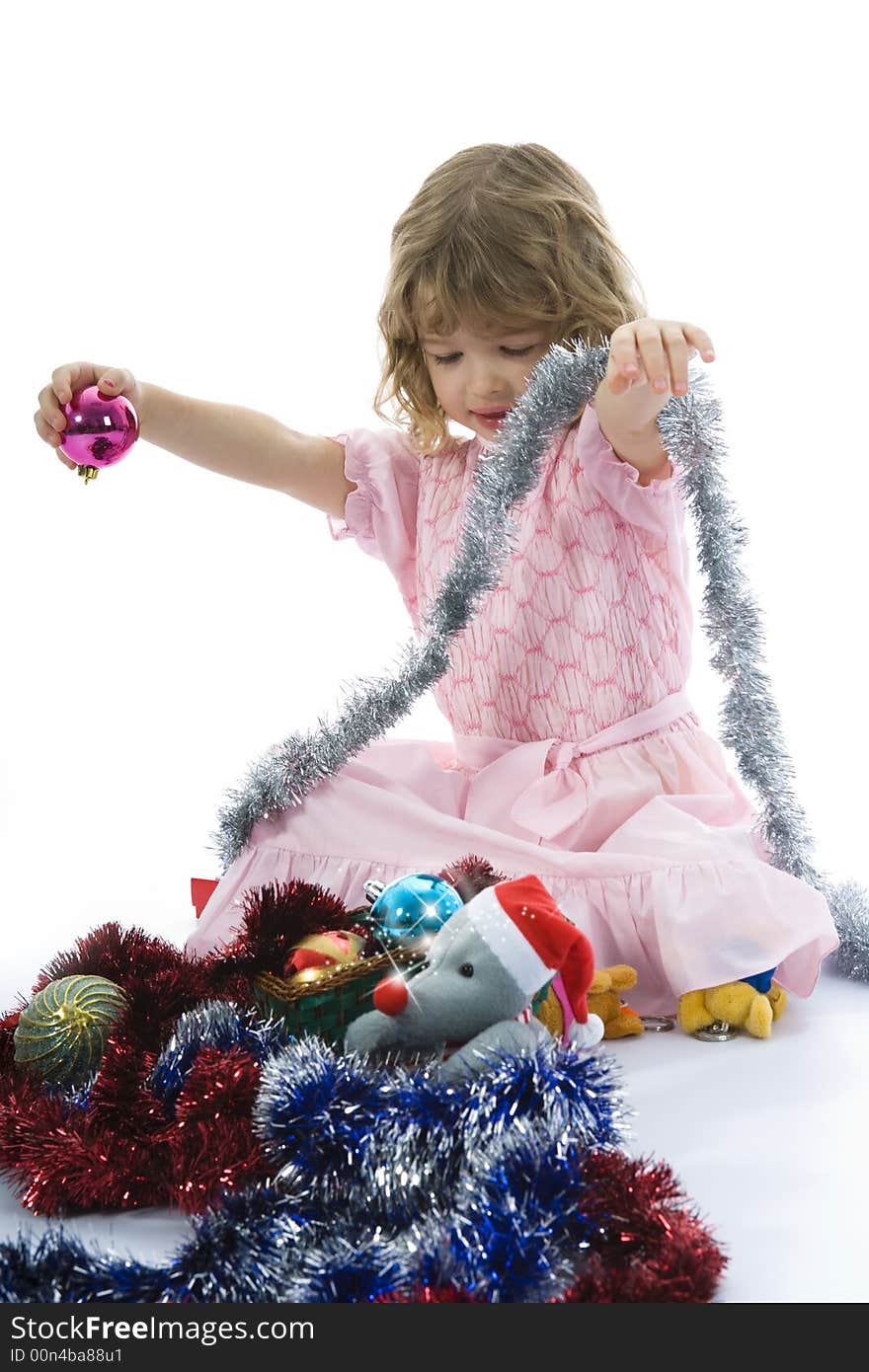 Beautiful little girl with christmas decoration on isolated background