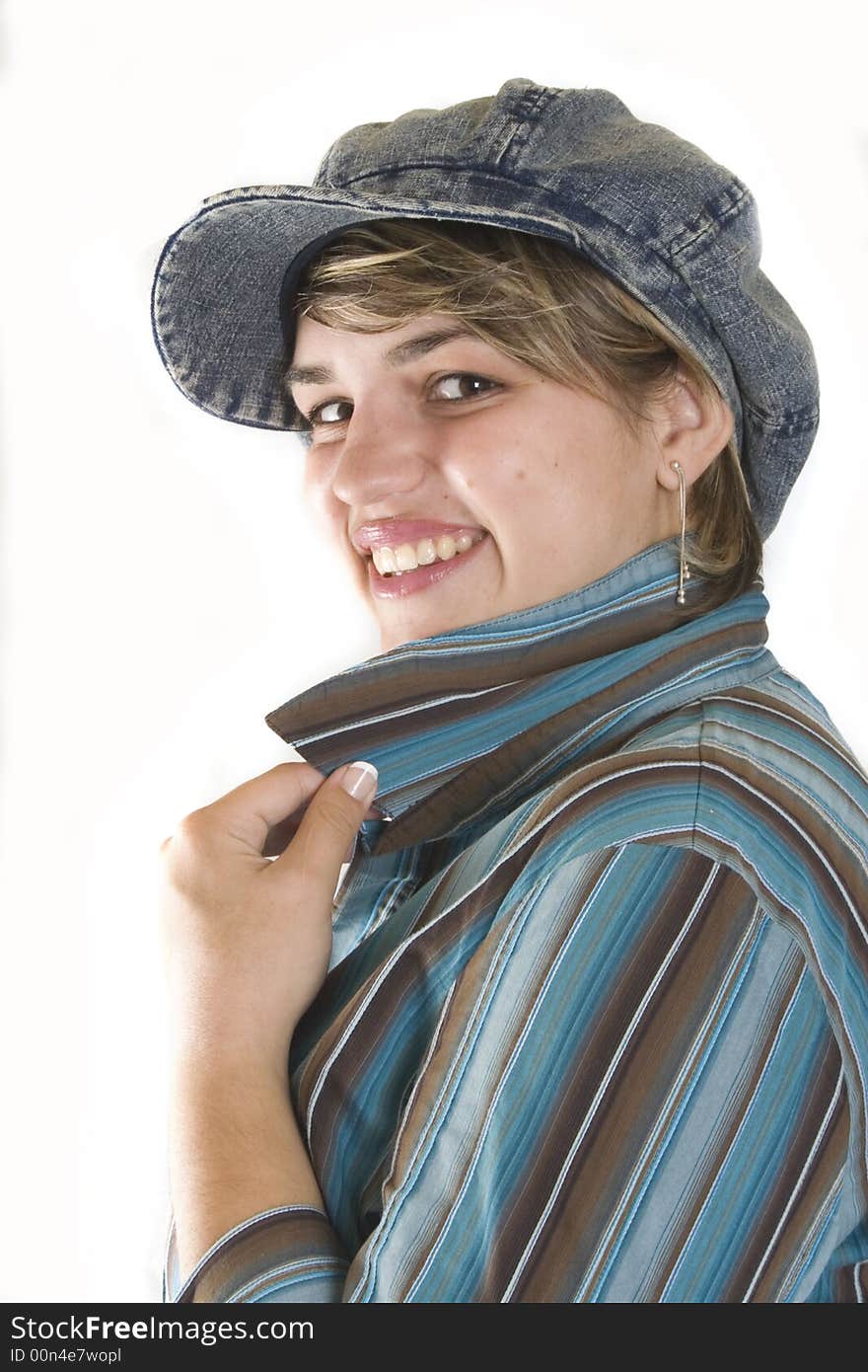 Portrait of a young attractive woman with cap