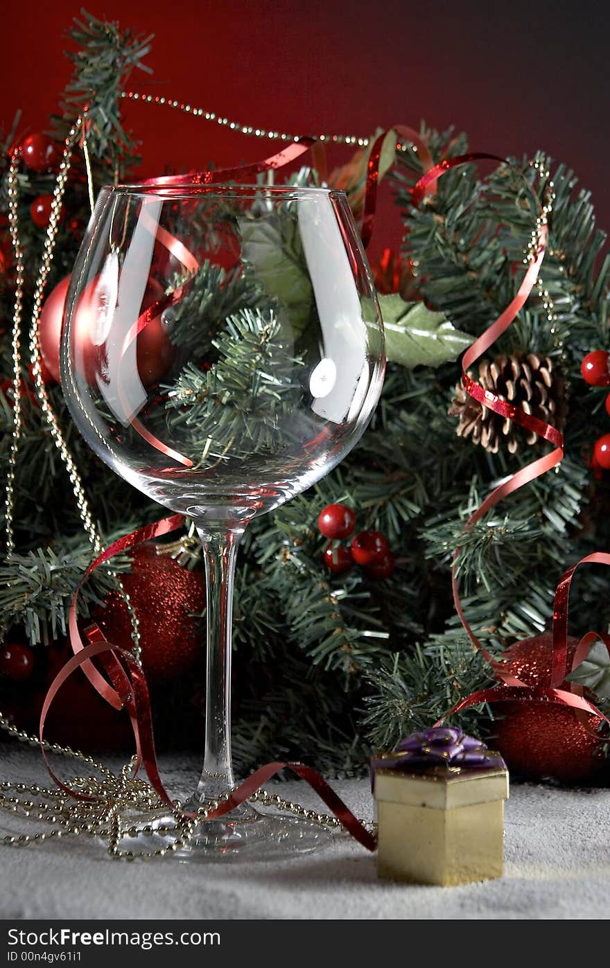 Still life with glass in front of fir tree