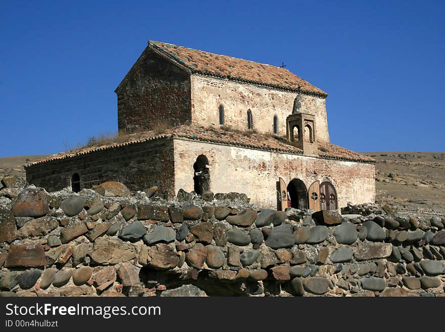 Georgian church with a wall in front of it