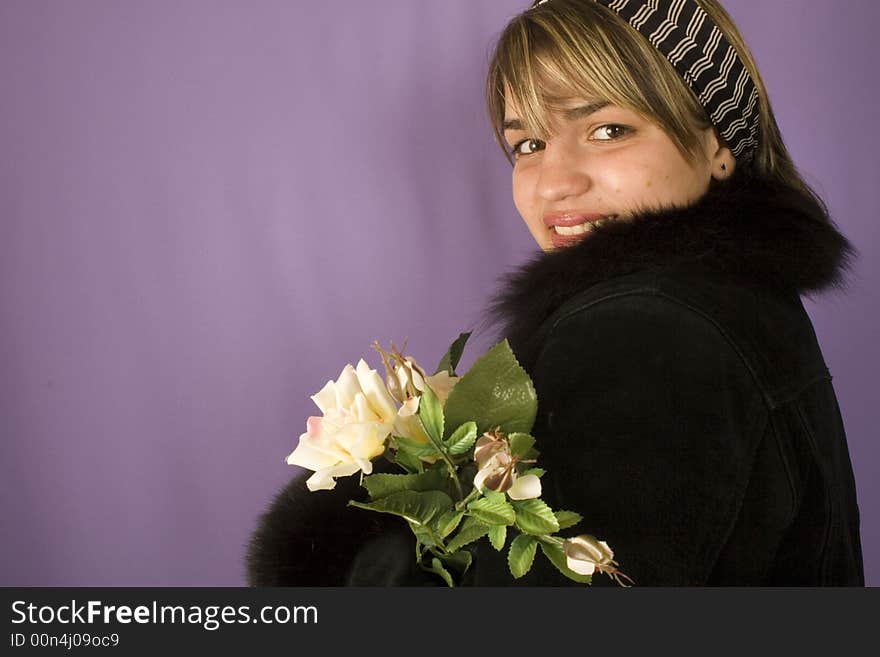 Portrait of a young attractive woman with rose