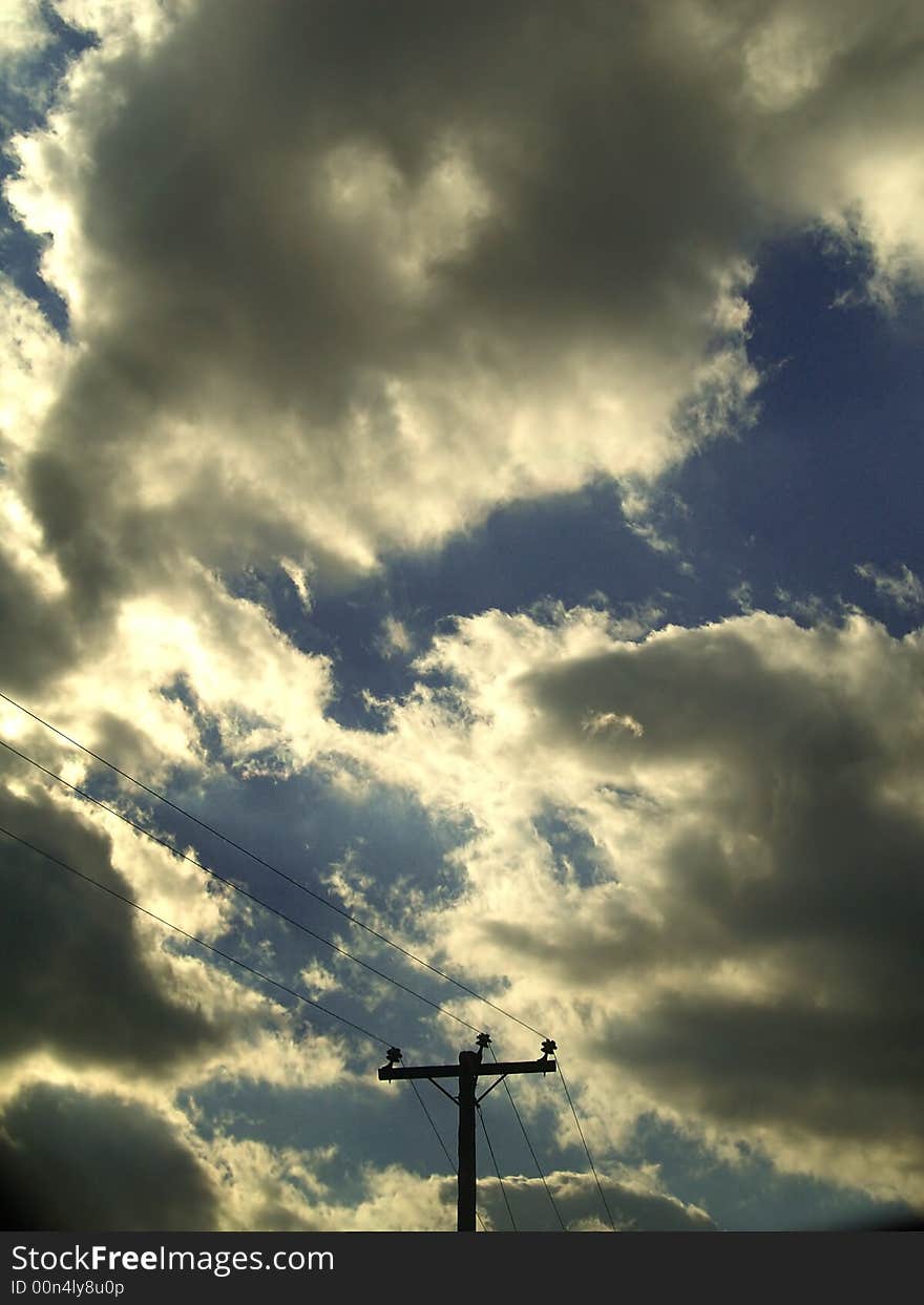 Dark clouds moving into a clear blue sky promise the arrival of a storm. Dark clouds moving into a clear blue sky promise the arrival of a storm.