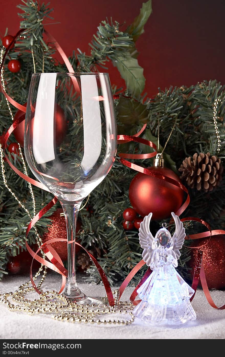 Still life with glass in front of fir tree