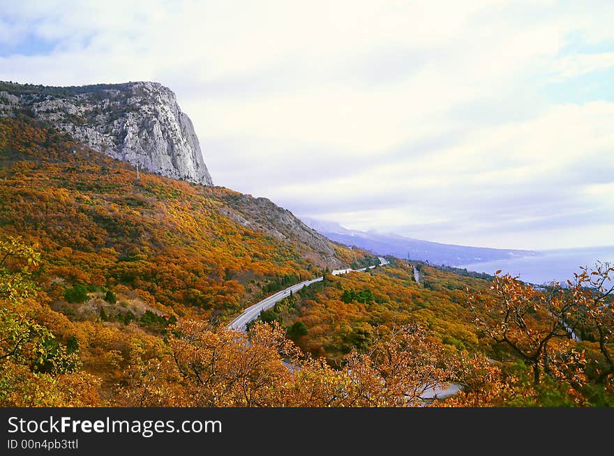 Mountain road on a background of the sky