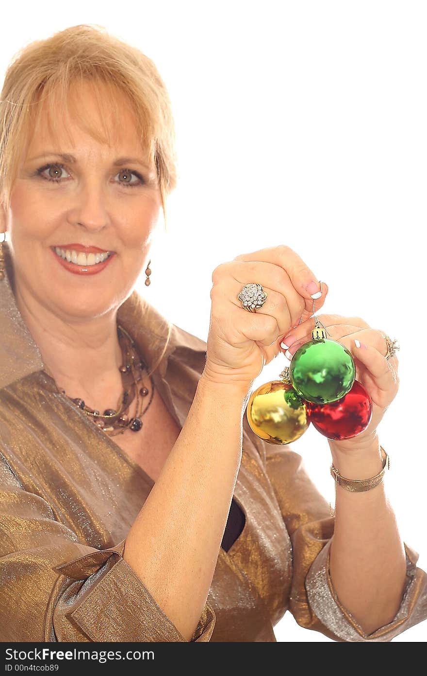 Shot of a woman with lots of Christmas ornaments