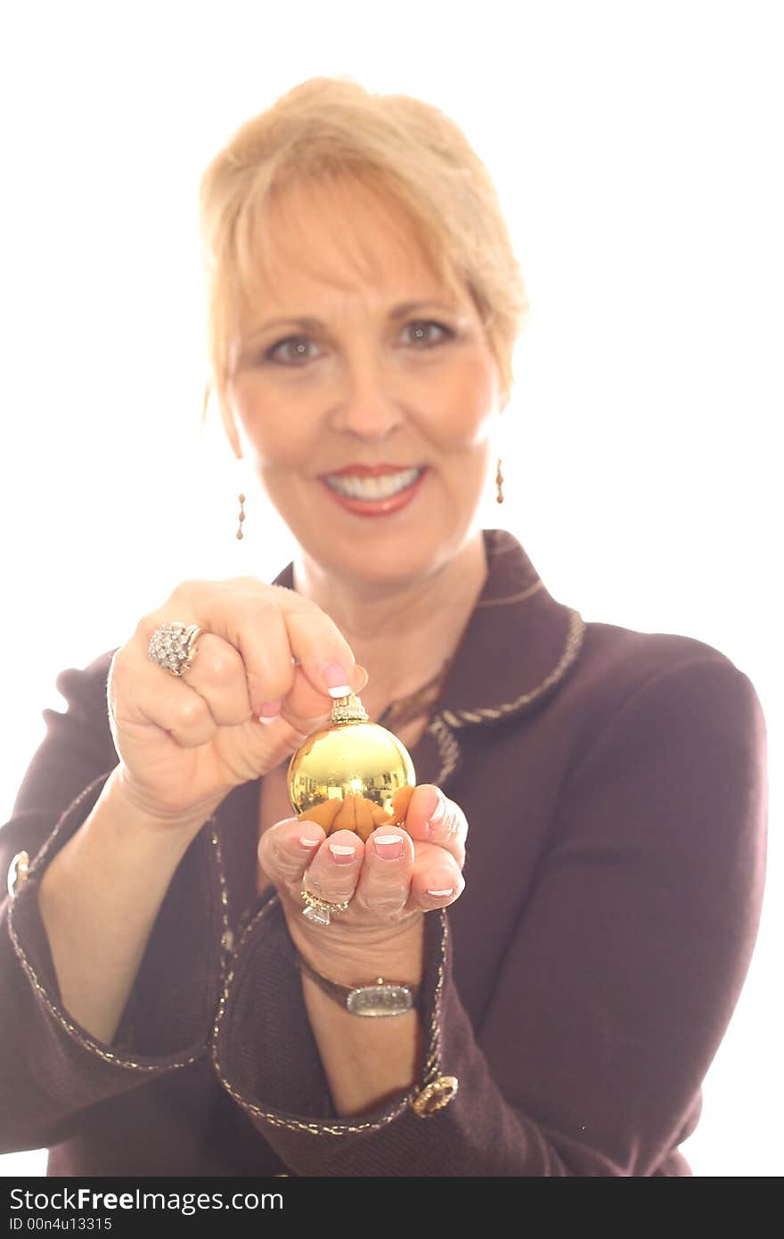 Shot of a woman with ornament in hand vertical