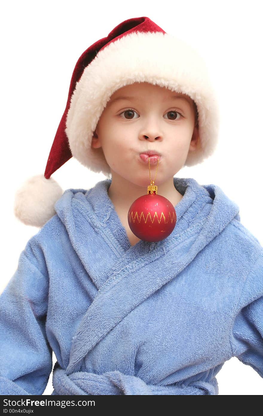 The nice boy in a New Year's cap on a white background