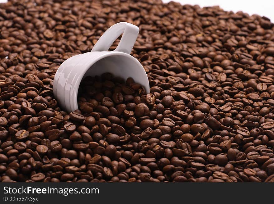 Cup with coffee, costing on coffee grain. Cup with coffee, costing on coffee grain