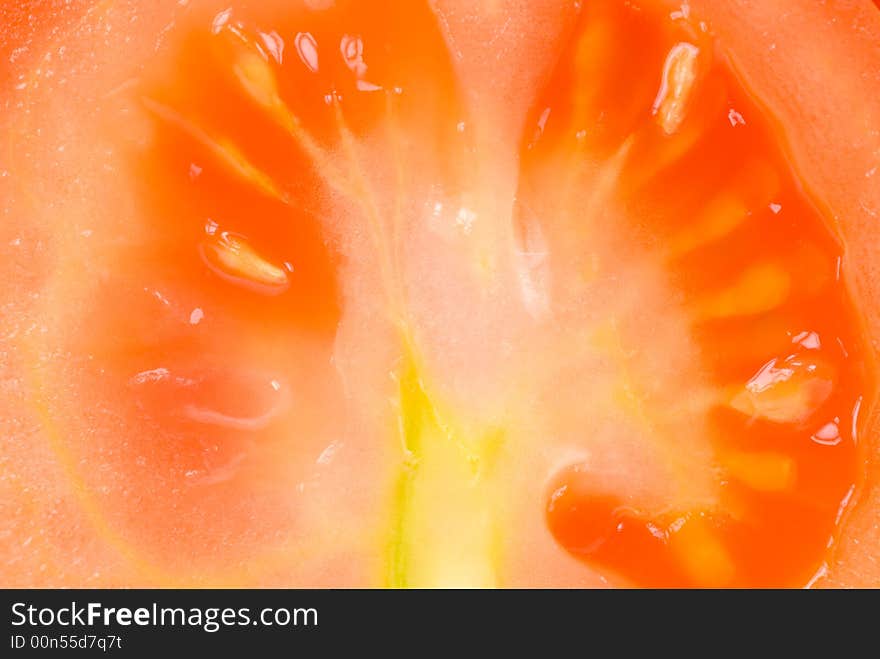 Macro of a fresh tomato for backgrounds. Macro of a fresh tomato for backgrounds