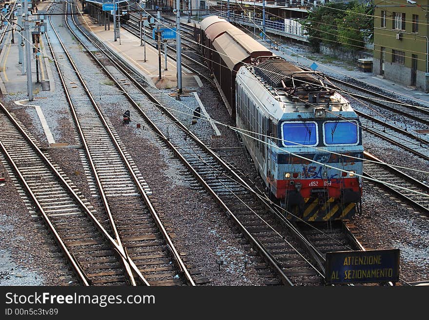 An old train leaving the station.