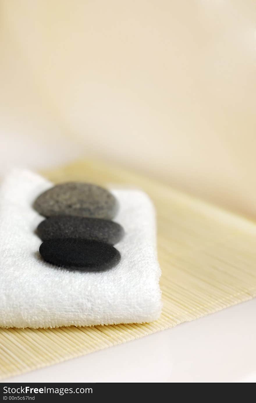 Pebble stones on white towel. Pebble stones on white towel