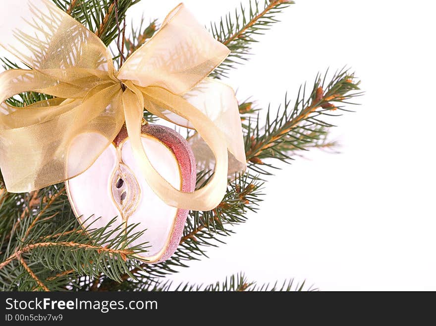 Christmas apple and gold ribbon isolated on white. Christmas apple and gold ribbon isolated on white