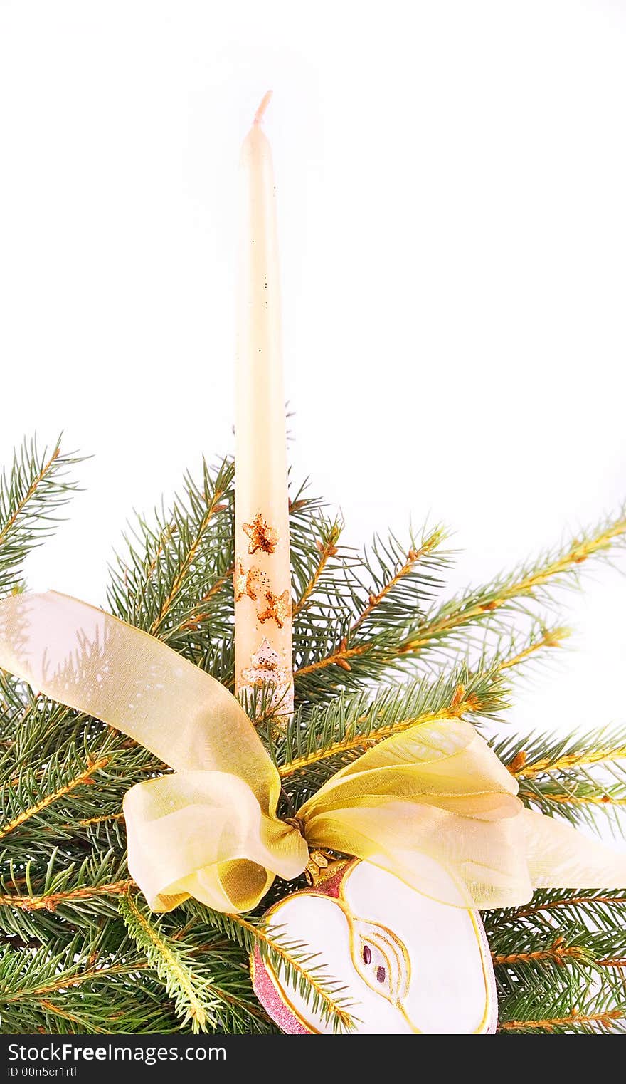 Christmas candle with gold ribbon isolated on white. Christmas candle with gold ribbon isolated on white