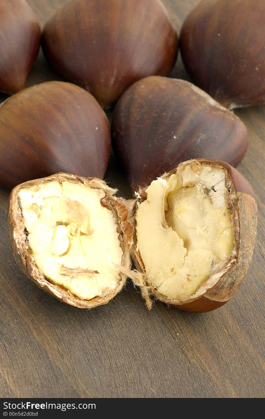 Group of chestnut in background of wood