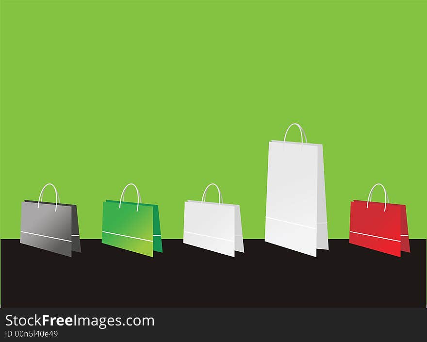 Shopping bags of different colors on green background