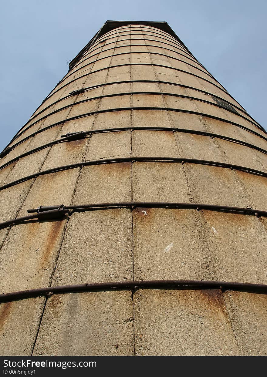 Old cement silo held together with steel rods